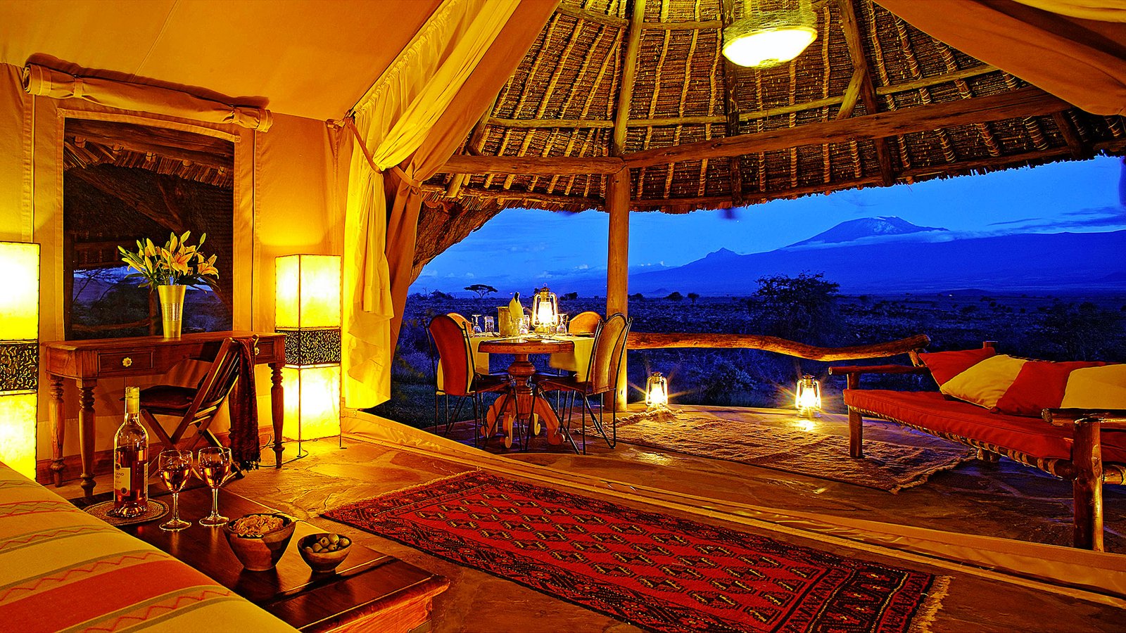 Safari vehicle on a game drive at sunset in Amboseli National Park